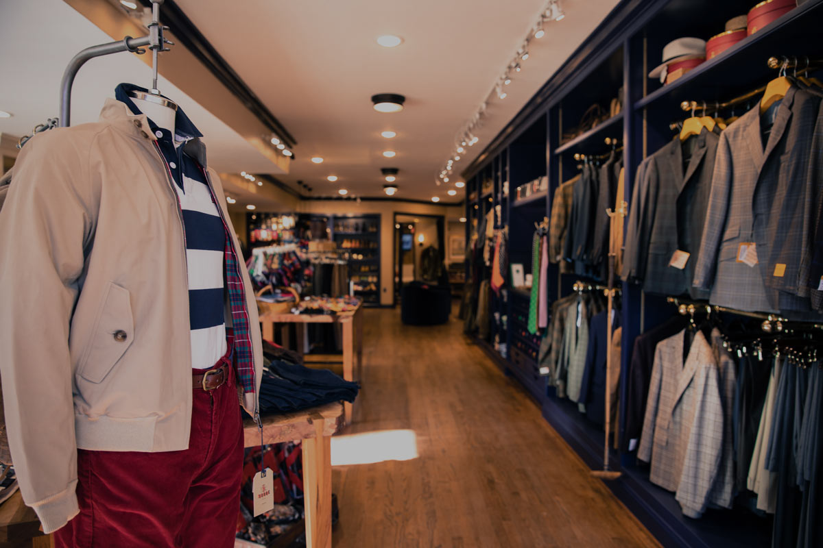 Clothing store with dressed manequin and shelves of men's clothing