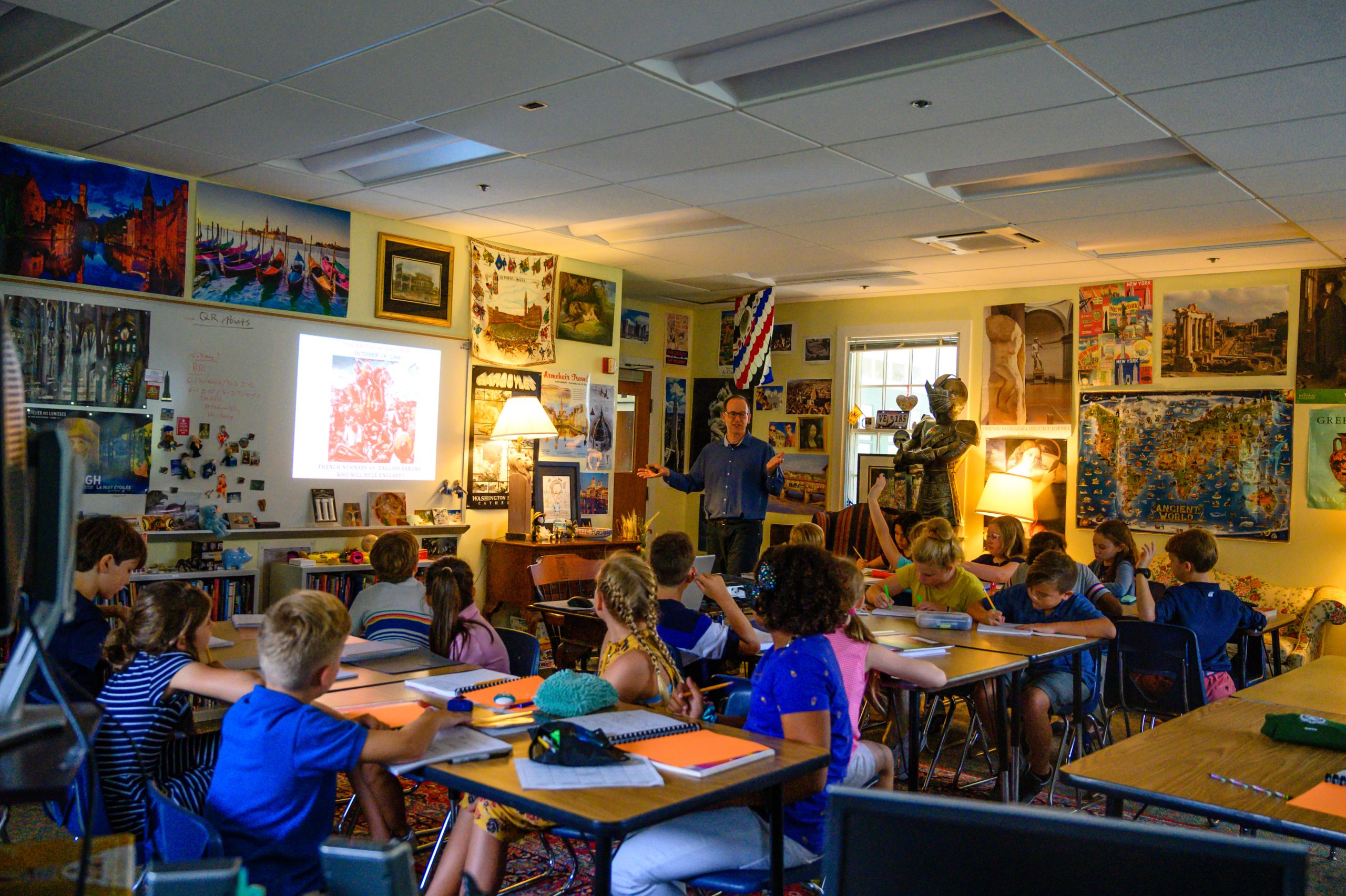 kids in classroom with teacher in front