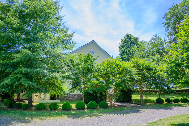 Building with green trees and shrubbery