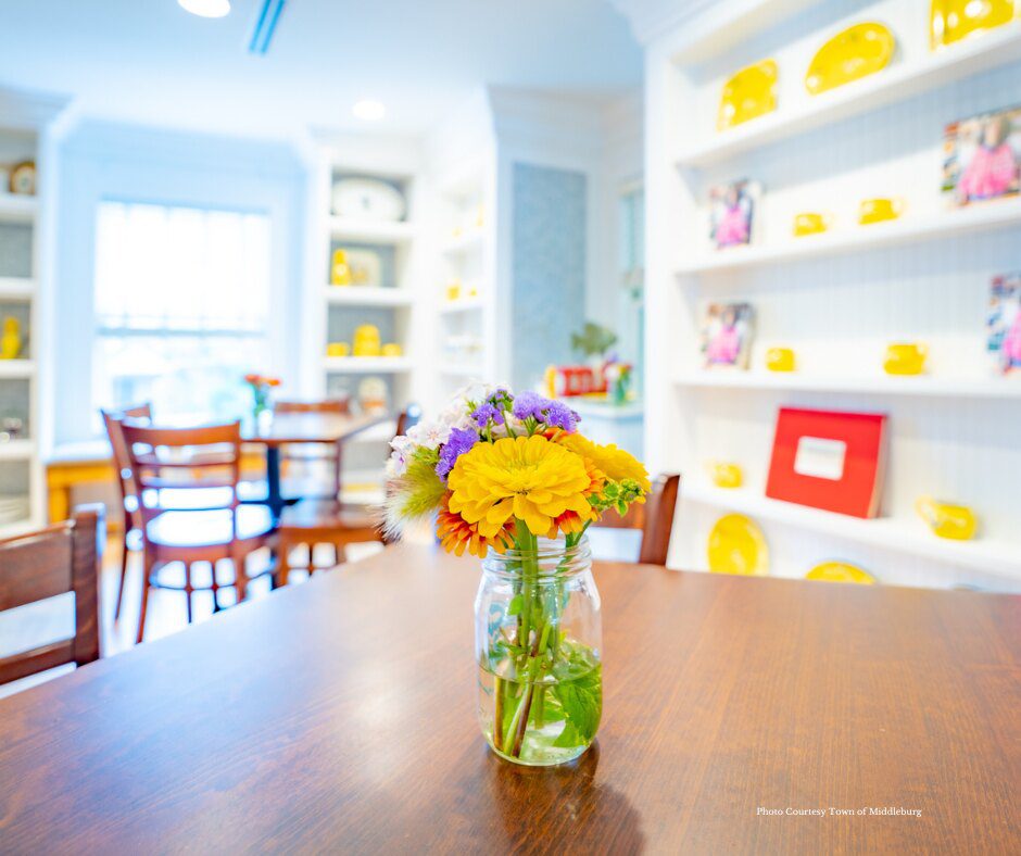 colorful yellow flowers on a table in a cafe
